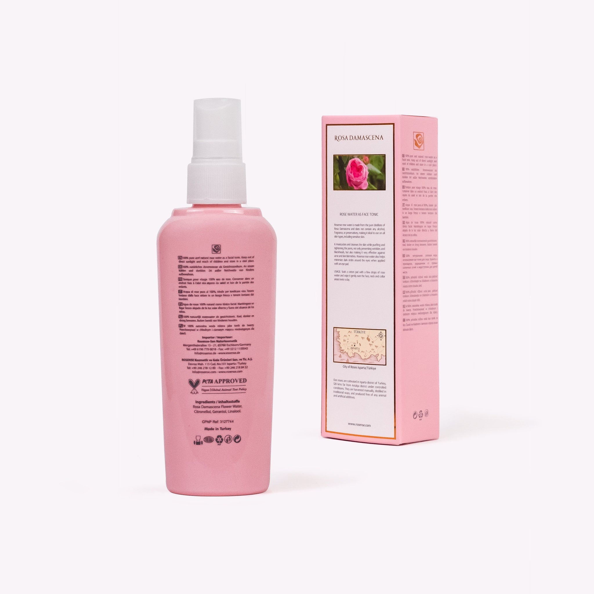 Rose water toner bottle, pink plastic with white spray nozzle, ROSA DAMASCENA text on label