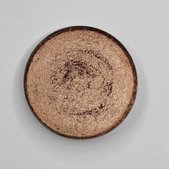 Close-up of Fresh Baked Shimmer Eyeshadow in Beige Blush showing soft pink-beige powder with golden shimmer particles