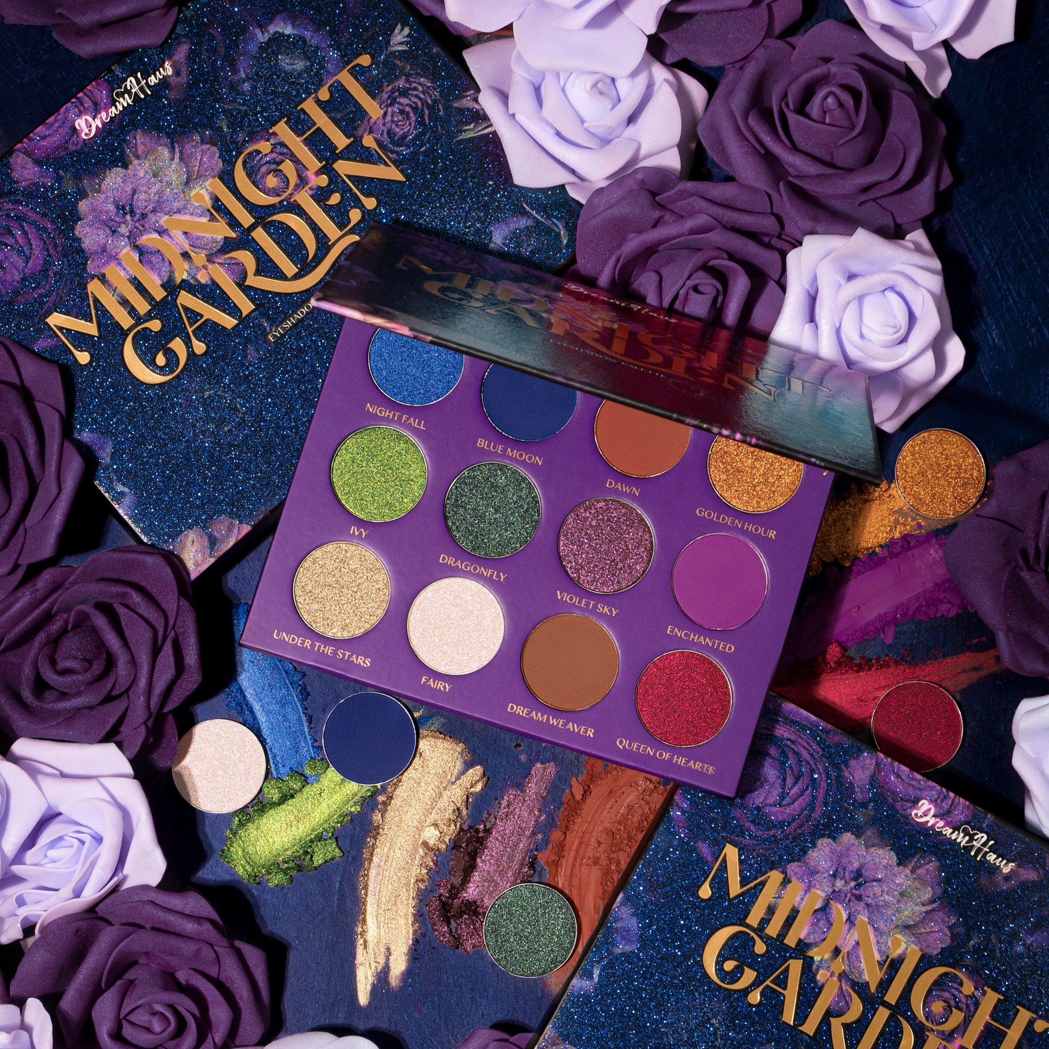 Close-up of Midnight Garden Eyeshadow Palette showing six vibrant matte and shimmer shades in purple, green, and gold hues
