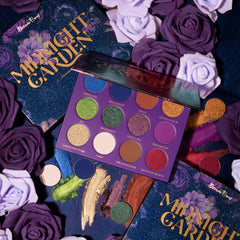 Close-up of Midnight Garden Eyeshadow Palette showing six vibrant matte and shimmer shades in purple, green, and gold hues