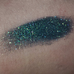 Close-up of a matte neutral-toned eye shadow palette with sleek black compact packaging