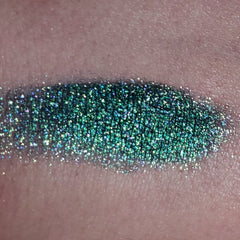 Close-up of shimmering bronze eye shadow palette with smooth satin finish and gradient color tones