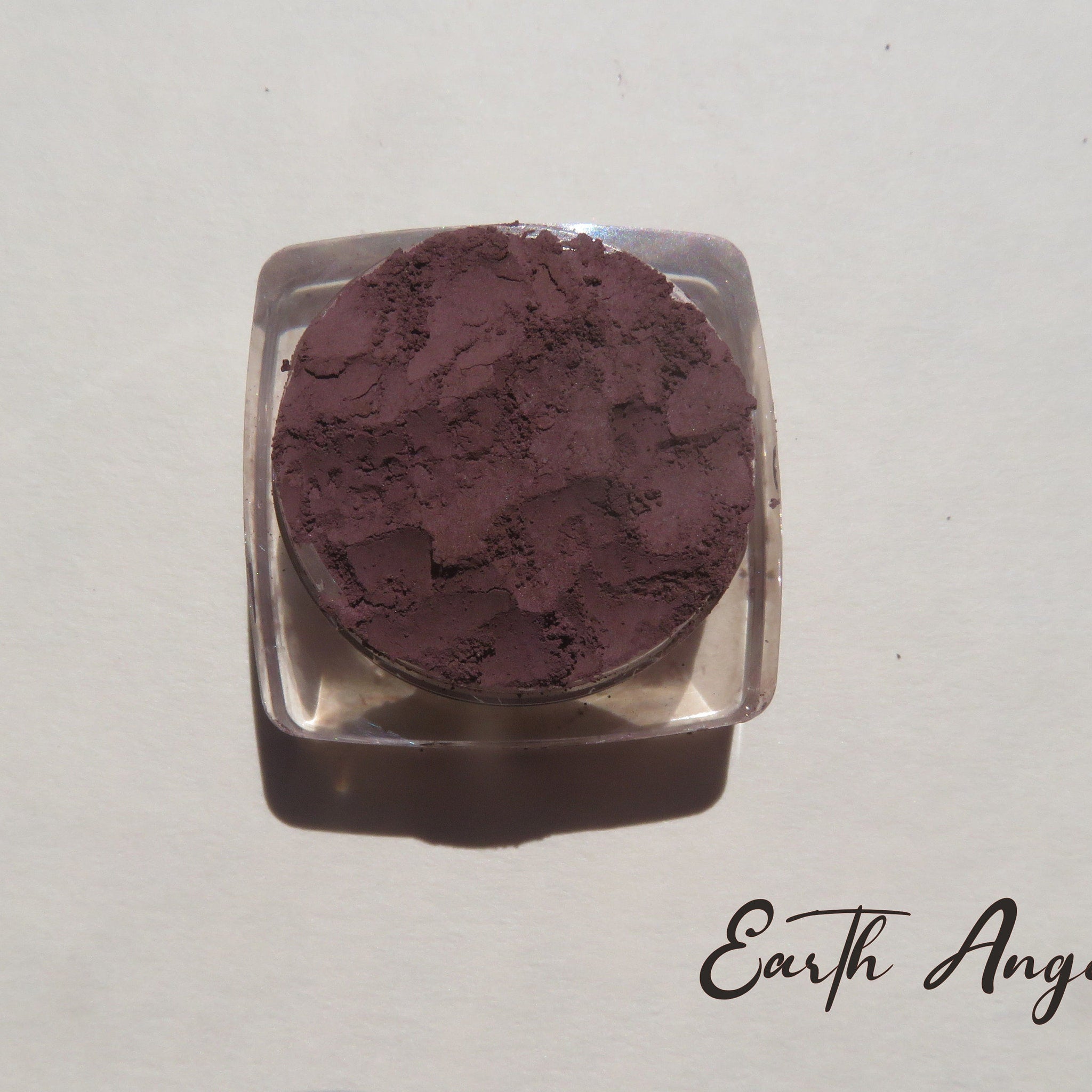 Earth Angel loose mineral eyeshadow in super dark muted purple with matte finish, vegan and cruelty-free.