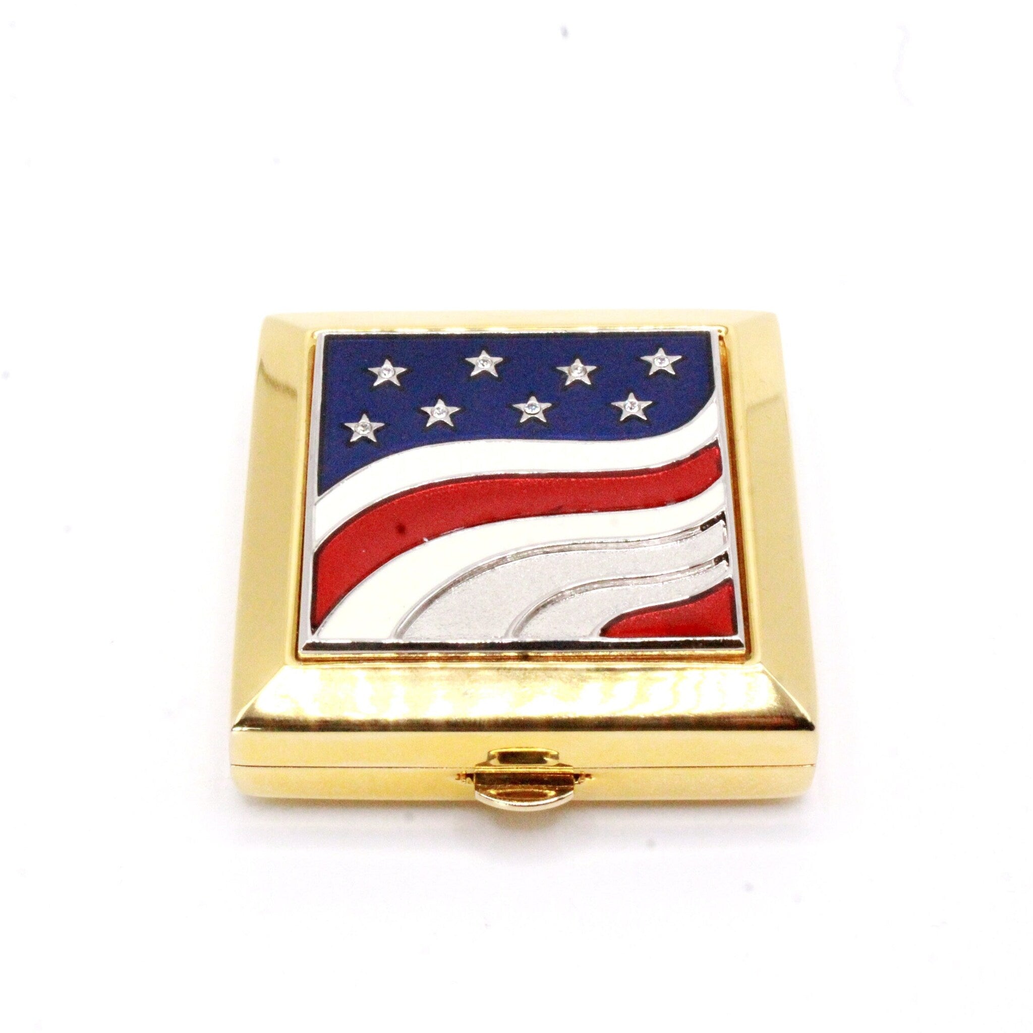Gold compact with American flag design, blue, red, and white enamel, square shape