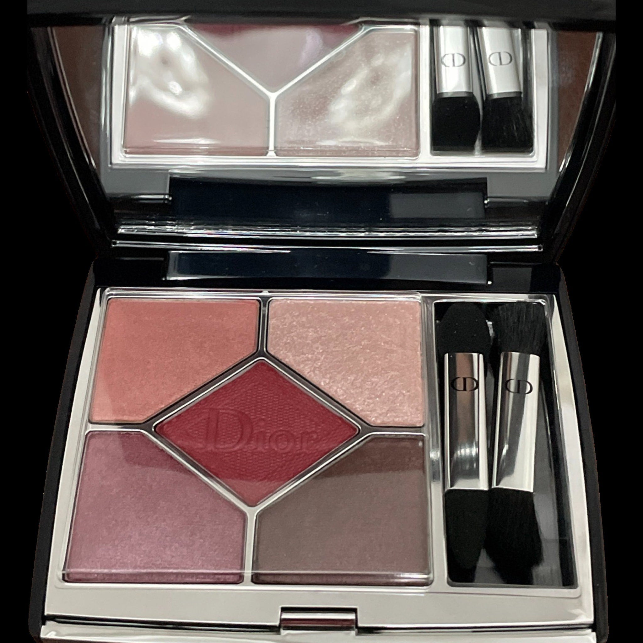 Close-up of Dior eyeshadow palette showing six vibrant matte and shimmer shades in jewel tones