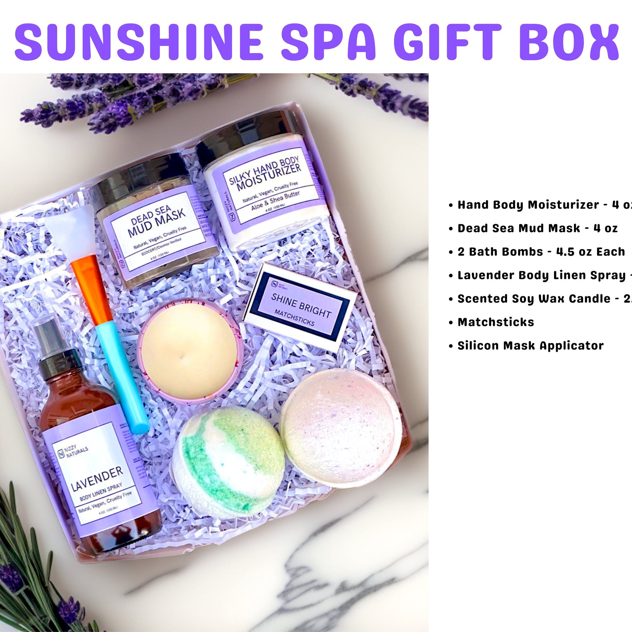 Spa gift box with lavender and white packaging, includes bath bombs and skincare products.