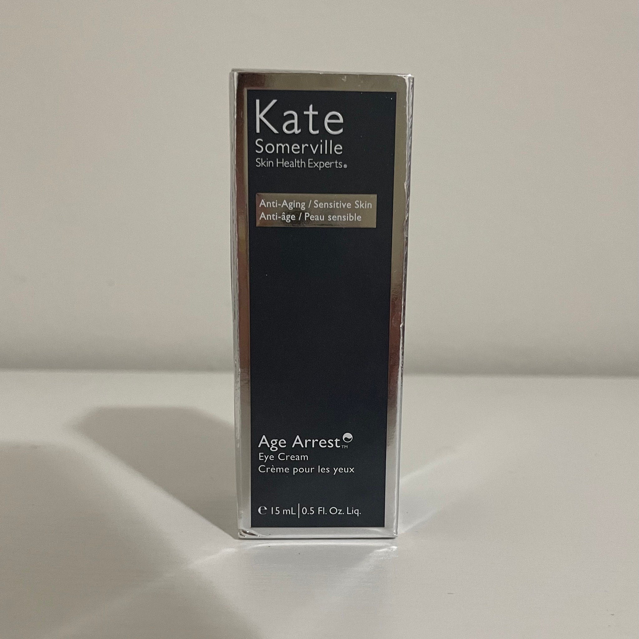 Eye cream product box with black and silver color scheme, and Kate Somerville branding visible