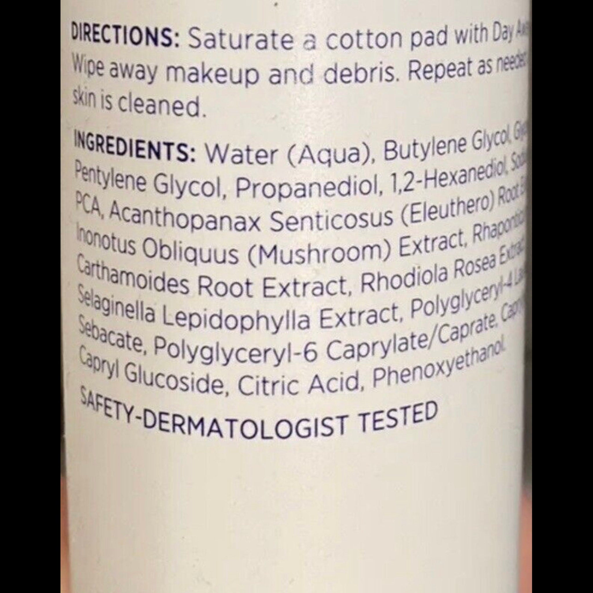 Skincare ingredients list on white background with blue text, for use with cotton pad