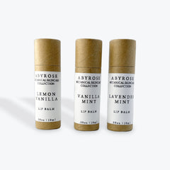 Lip balm tubes, brown cardboard, white label, Abyrose brand, Lemon Vanilla, Vanilla Mint, Lavender Mint flavors