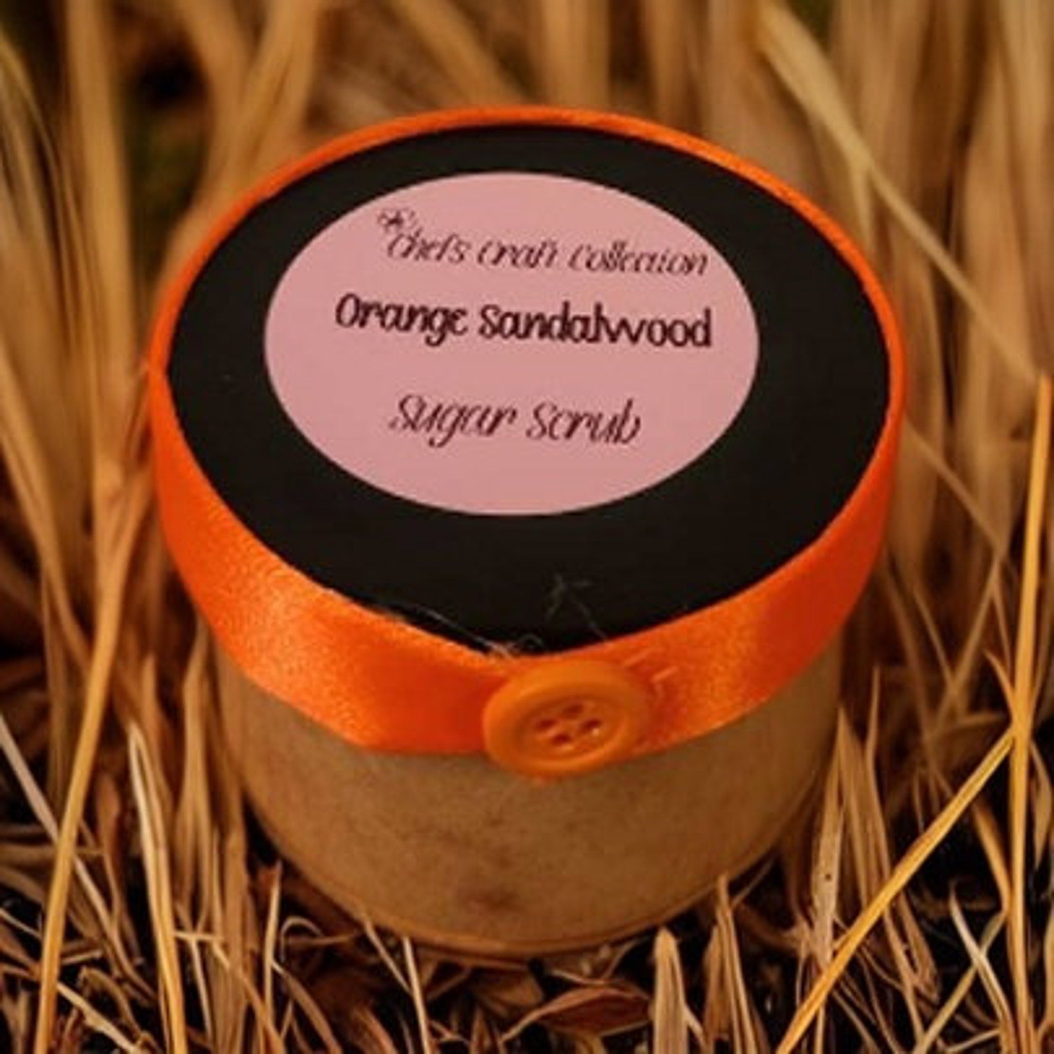 Sugar scrub jar with orange ribbon, black lid, and button closure, Chef's Craft Collection label