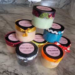 Exfoliating Scrub jars with colorful lids, ribbon accents, and Chefs Collection labels