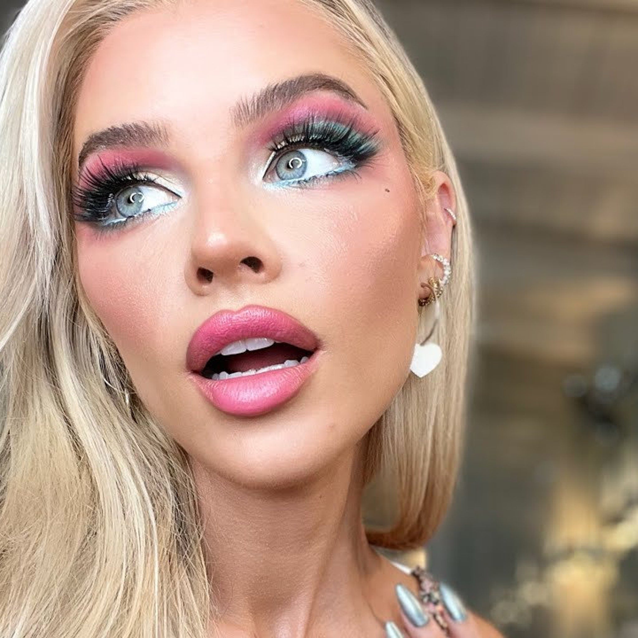 Close-up of sparkly Barbie pink eyeshadow palette showing shimmer texture and vegan makeup details
