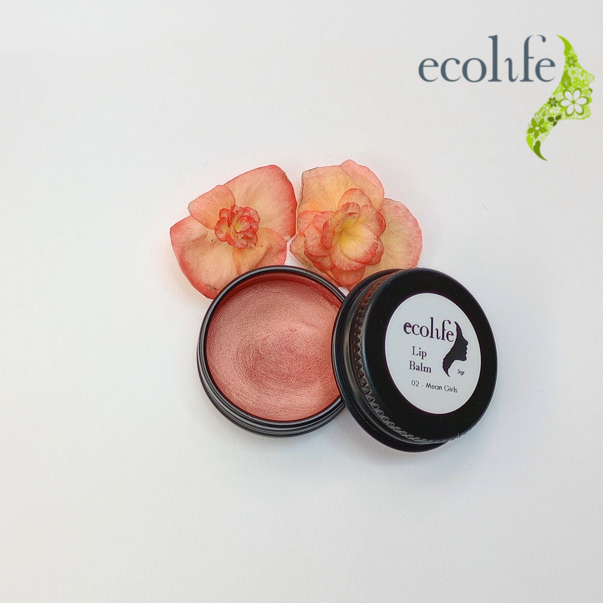Lip balm with metallic coral color in black tin with Ecolife brand and flowers