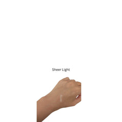 Sheer Light swatch on skin, light beige color, hand showing application
