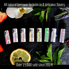 Beeswax lip balm tubes in various colors with brand name and flavor text on black background