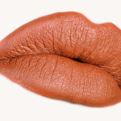 Lip makeup burnt orange color lips texture close up