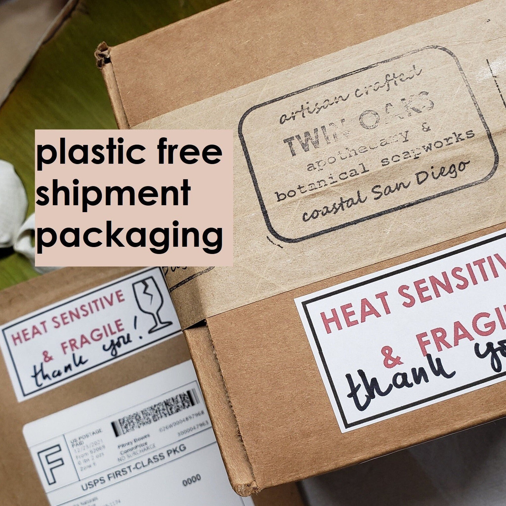 Cardboard boxes with printed labels and tape, "Twin Oaks" branding visible, for shipping