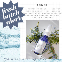 Rose spritzer bottle, blue glass, white label, with floral and botanical elements