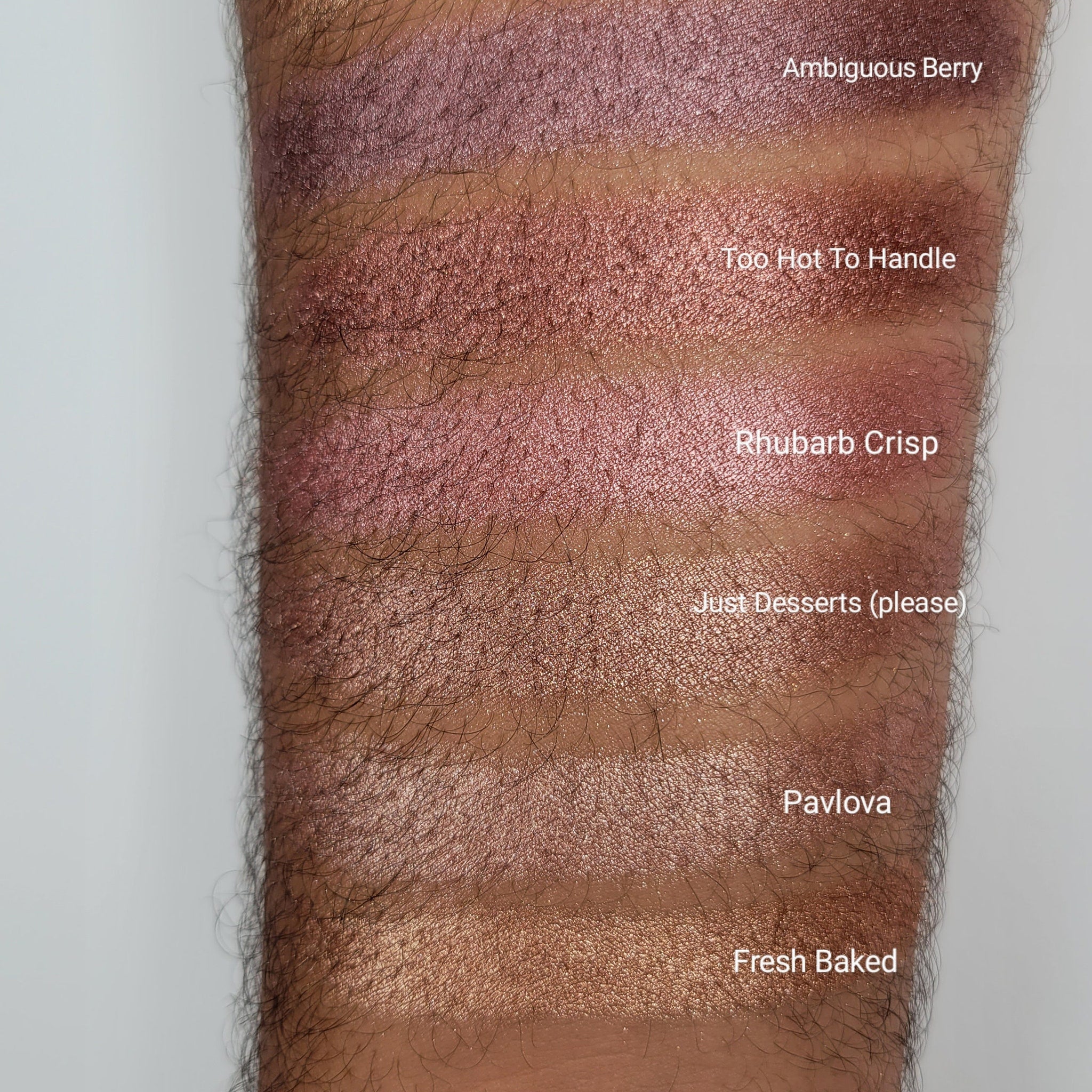 Side view of Fresh Baked Shimmer Eyeshadow in Beige Blush showing domed powder texture and compact case