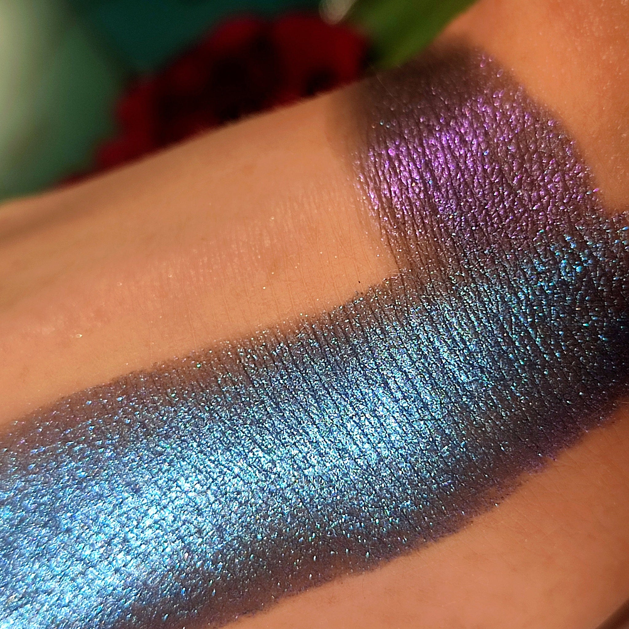 Eyeshadow swatches, blue and purple shimmering colors on skin, makeup application demo
