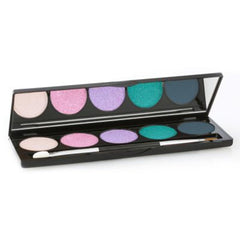 Close-up of artist applying vibrant teal eye shadow with a fluffy brush onto eyelid