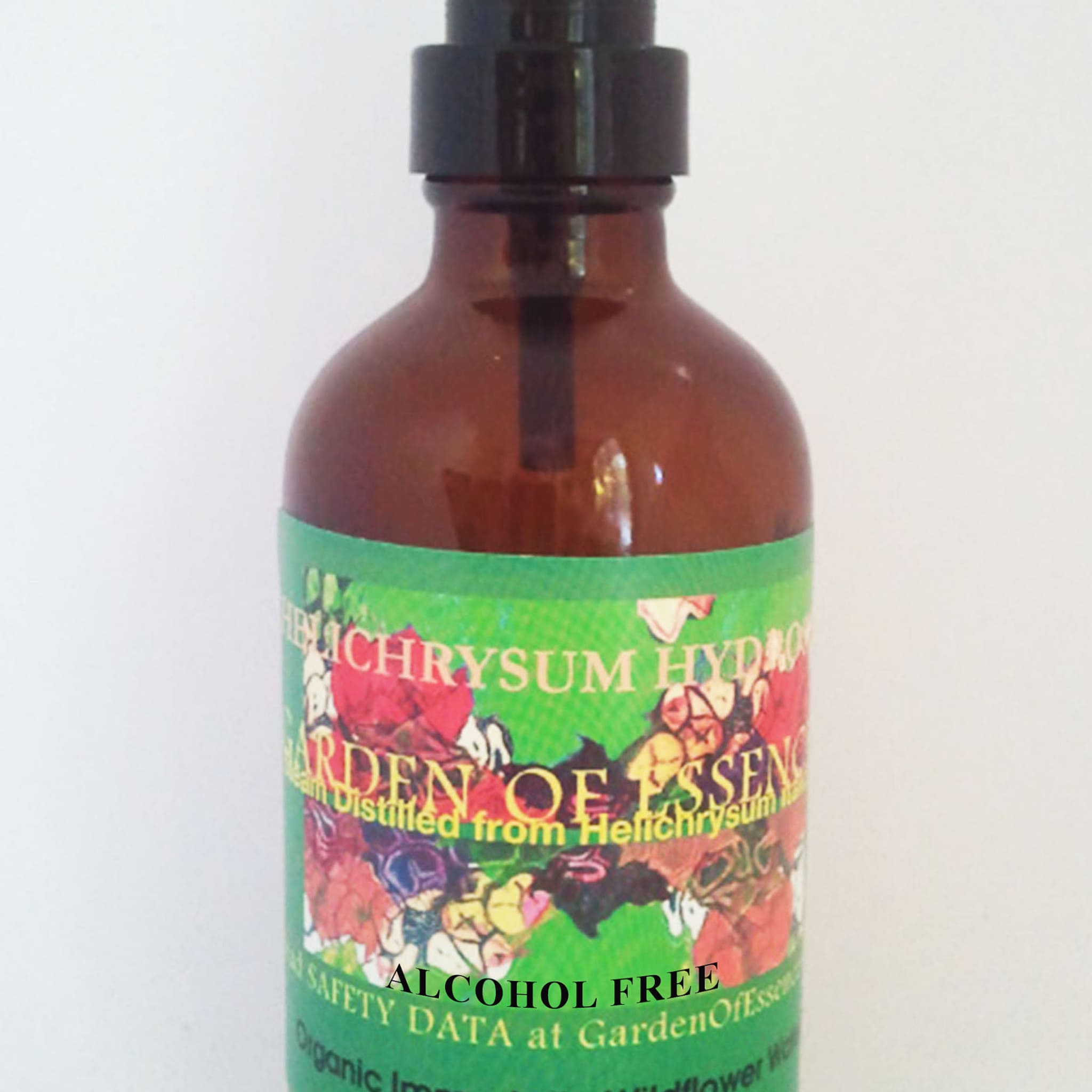 Brown glass spray bottle with black pump and green label, GardenOfEssences brand