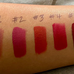 Lipstick swatches on skin in red, pink, and orange shades, numbered for comparison