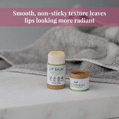 Lip balm, white and brown tube, jnlnaturals brand, on a white surface with a gray towel in background