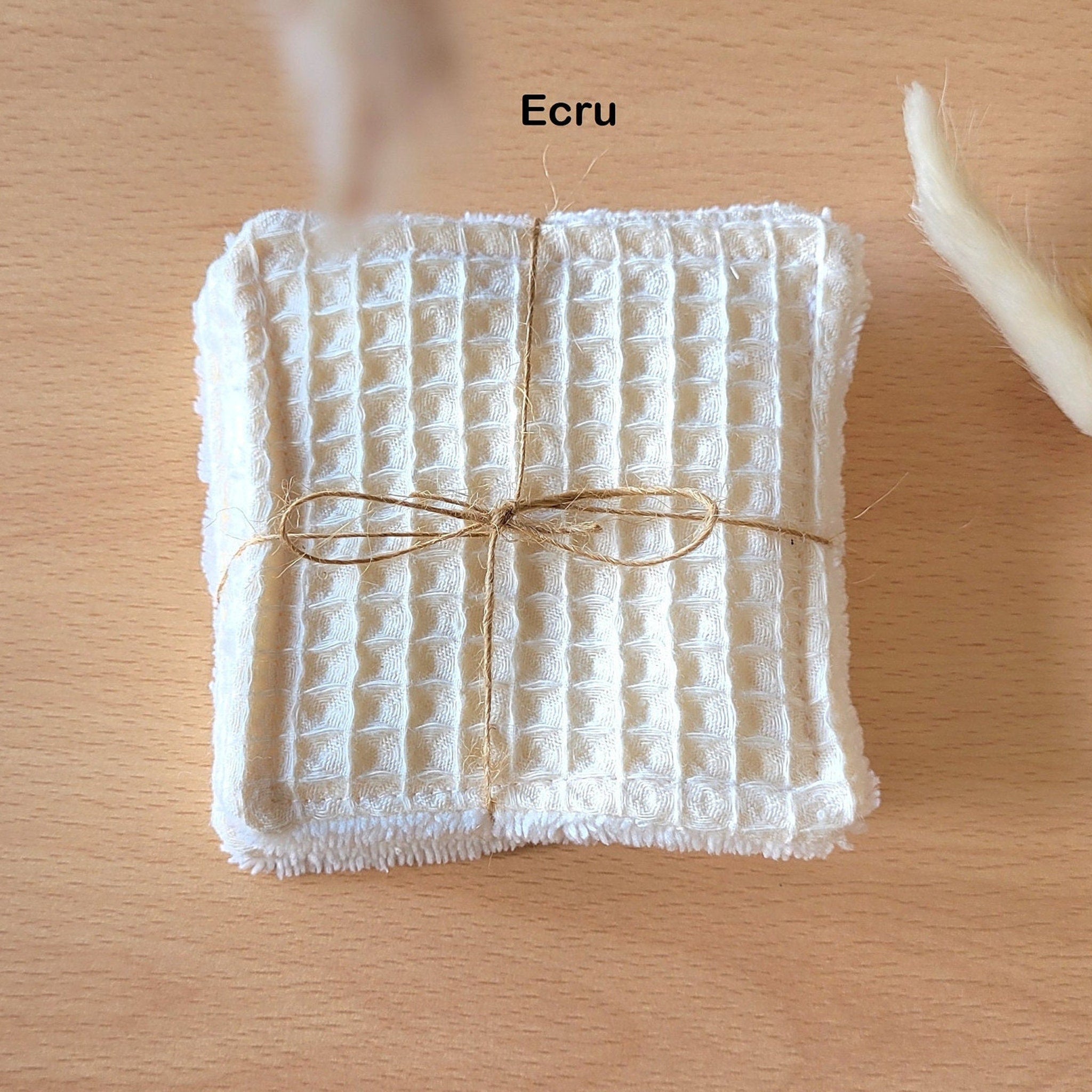 Side view of soft bamboo and cotton gauze wipes in eco-friendly packaging with textured surface detail