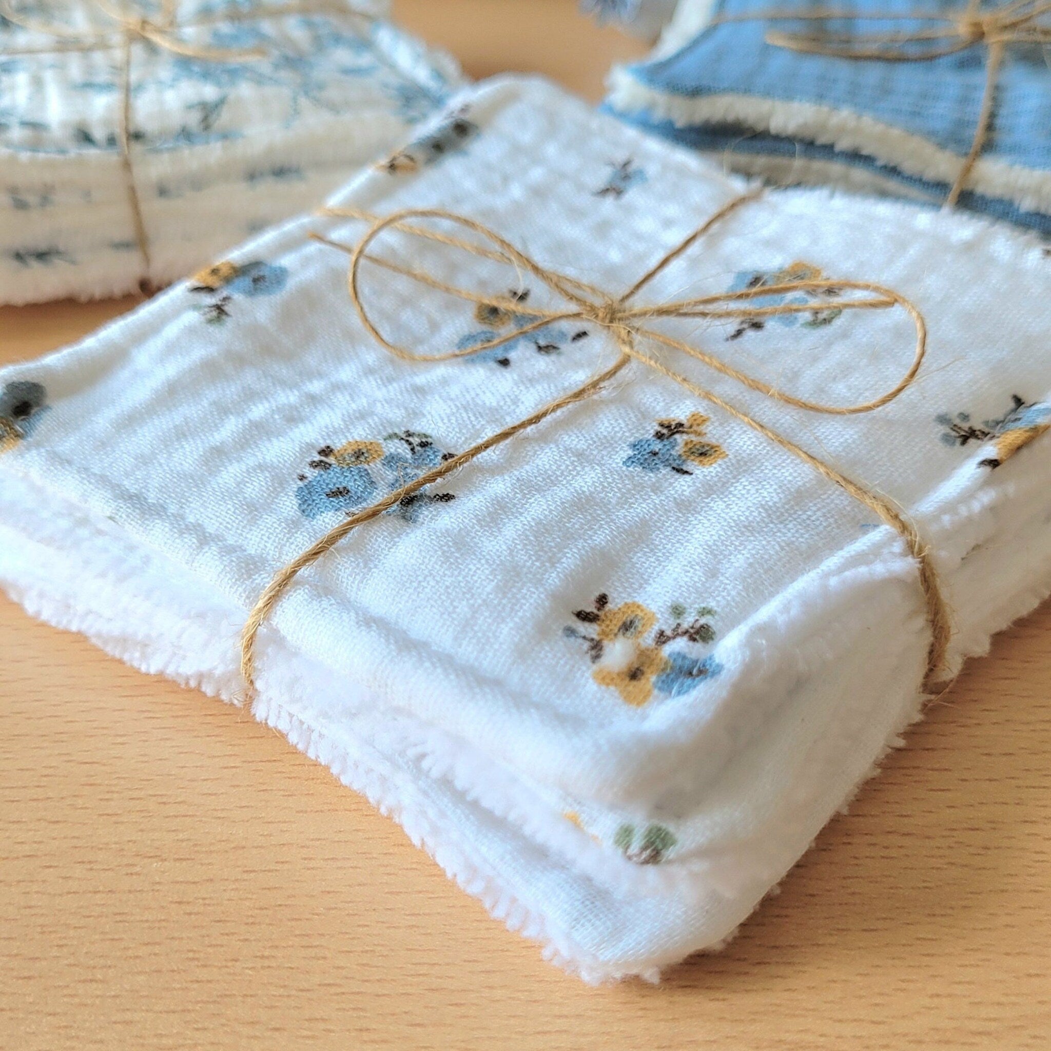 Close-up of soft bamboo and cotton gauze wipes showing delicate texture and natural fibers for gentle skincare