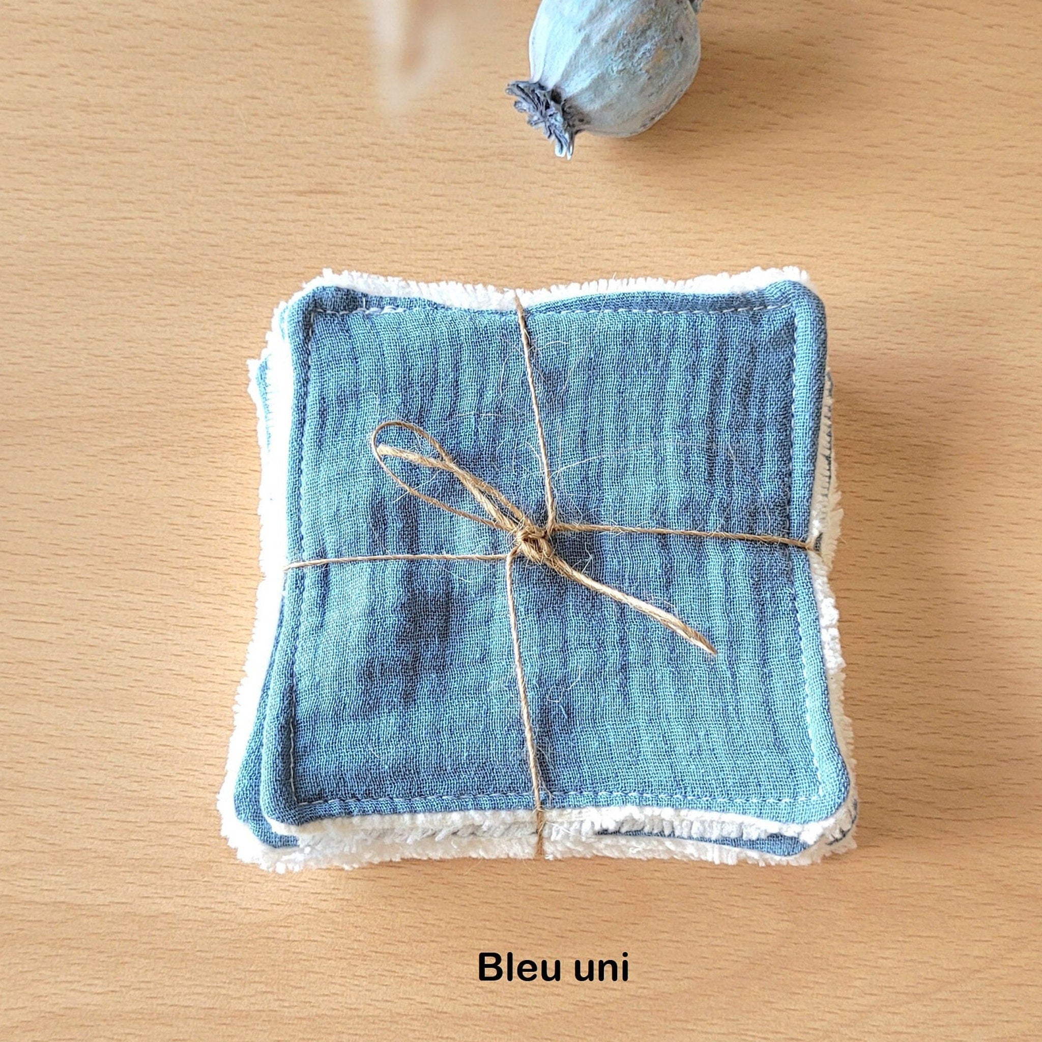 Side view of soft bamboo and cotton gauze wipes in pastel packaging with eco-friendly leaf motif