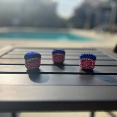 Lip therapy containers with blue, pink, and clear crystal embellishments, Vaseline brand visible