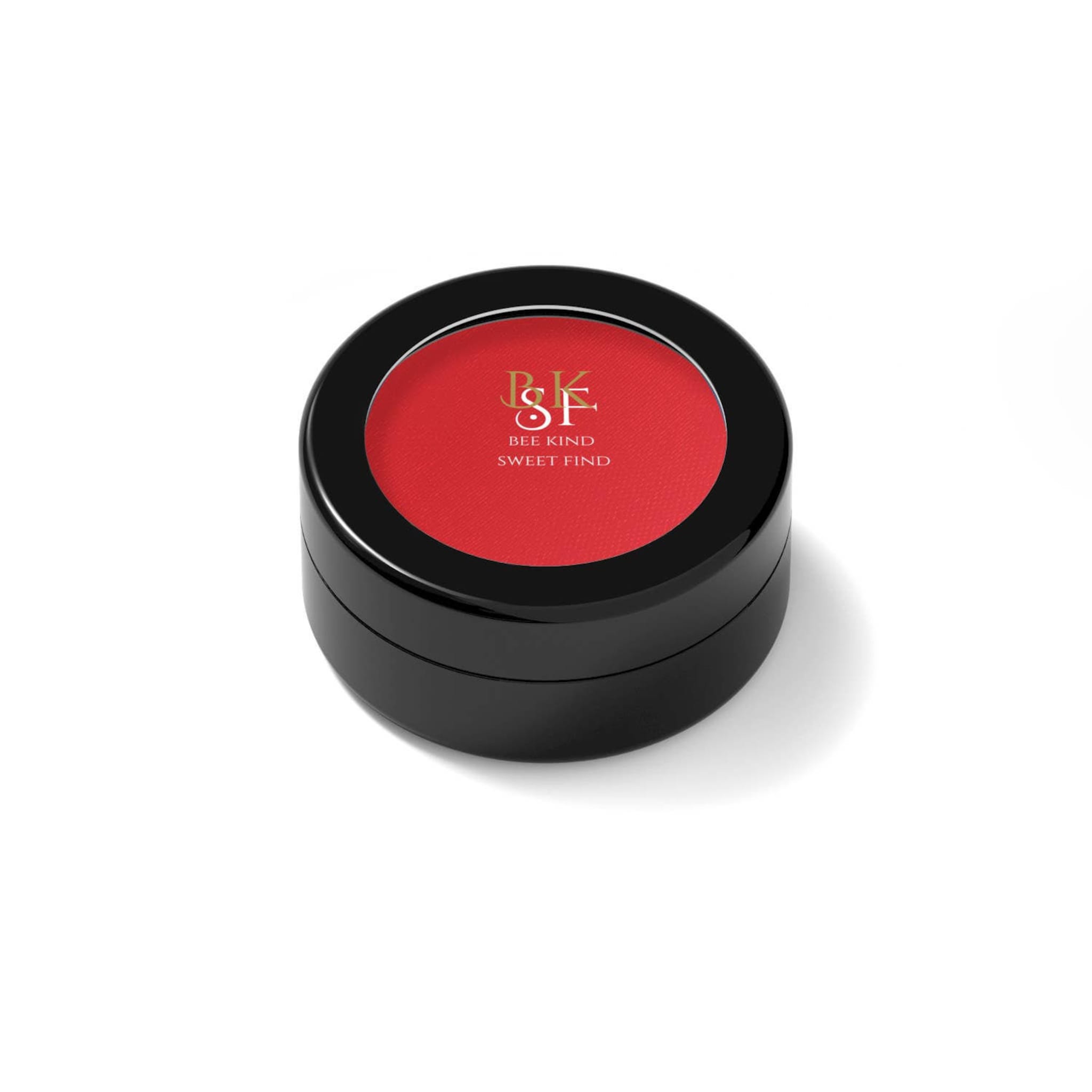 Red compact with black casing, BKSF brand text visible on the lid