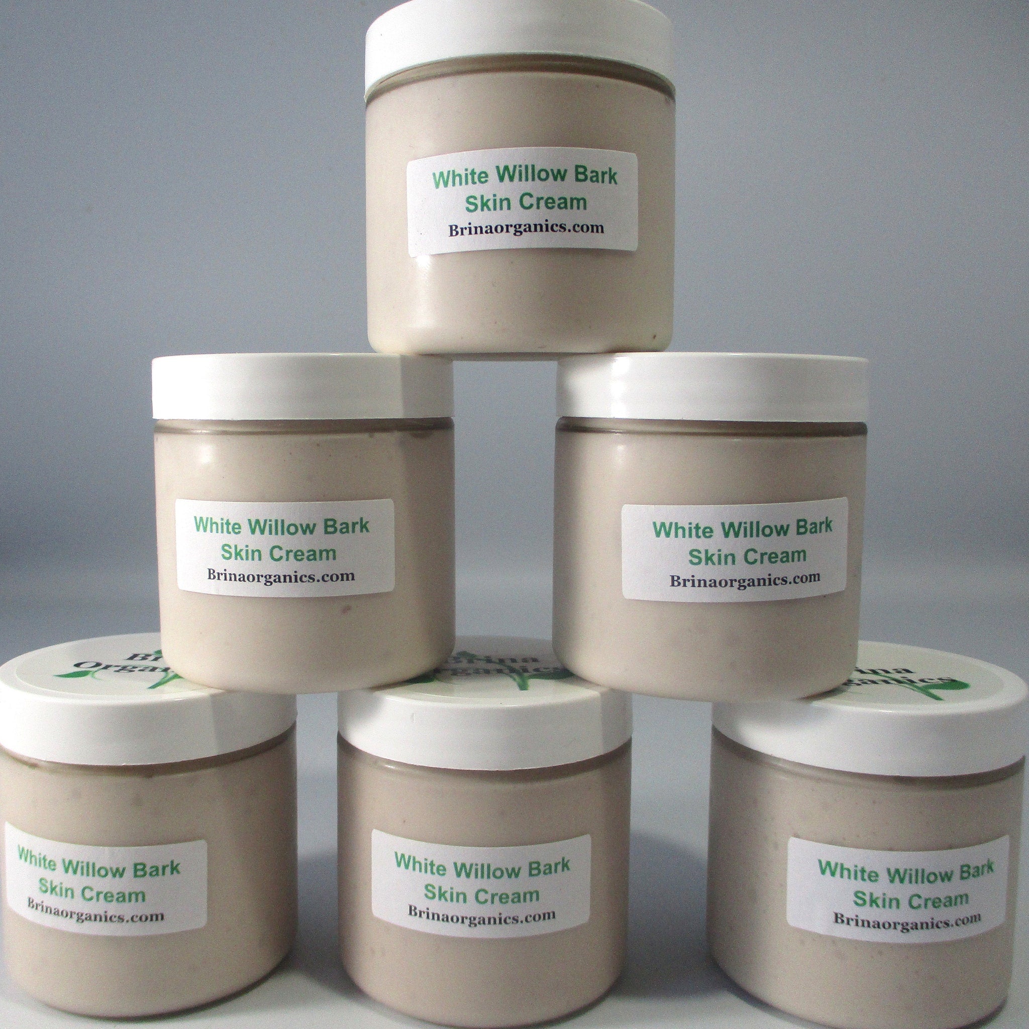White Willow Bark Skin Cream, beige cream in clear jars with white lids, Brinaorganics.com label visible