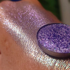 Side view of Blu Viola pressed powder eyeshadow in deep violet with satin finish, showcasing compact size