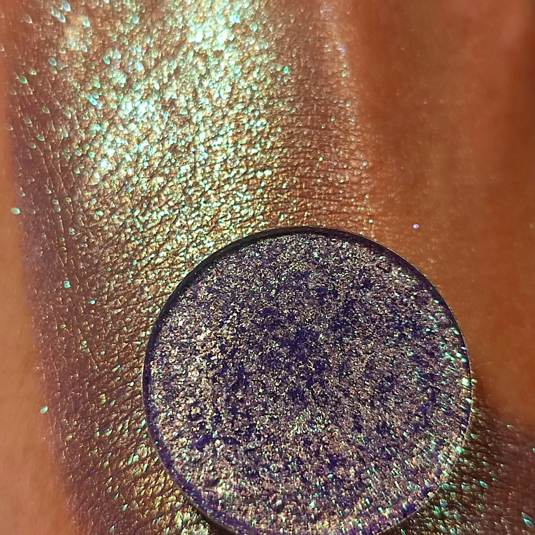 Side view of Blu Viola pressed powder eye shadow in deep violet with smooth satin finish