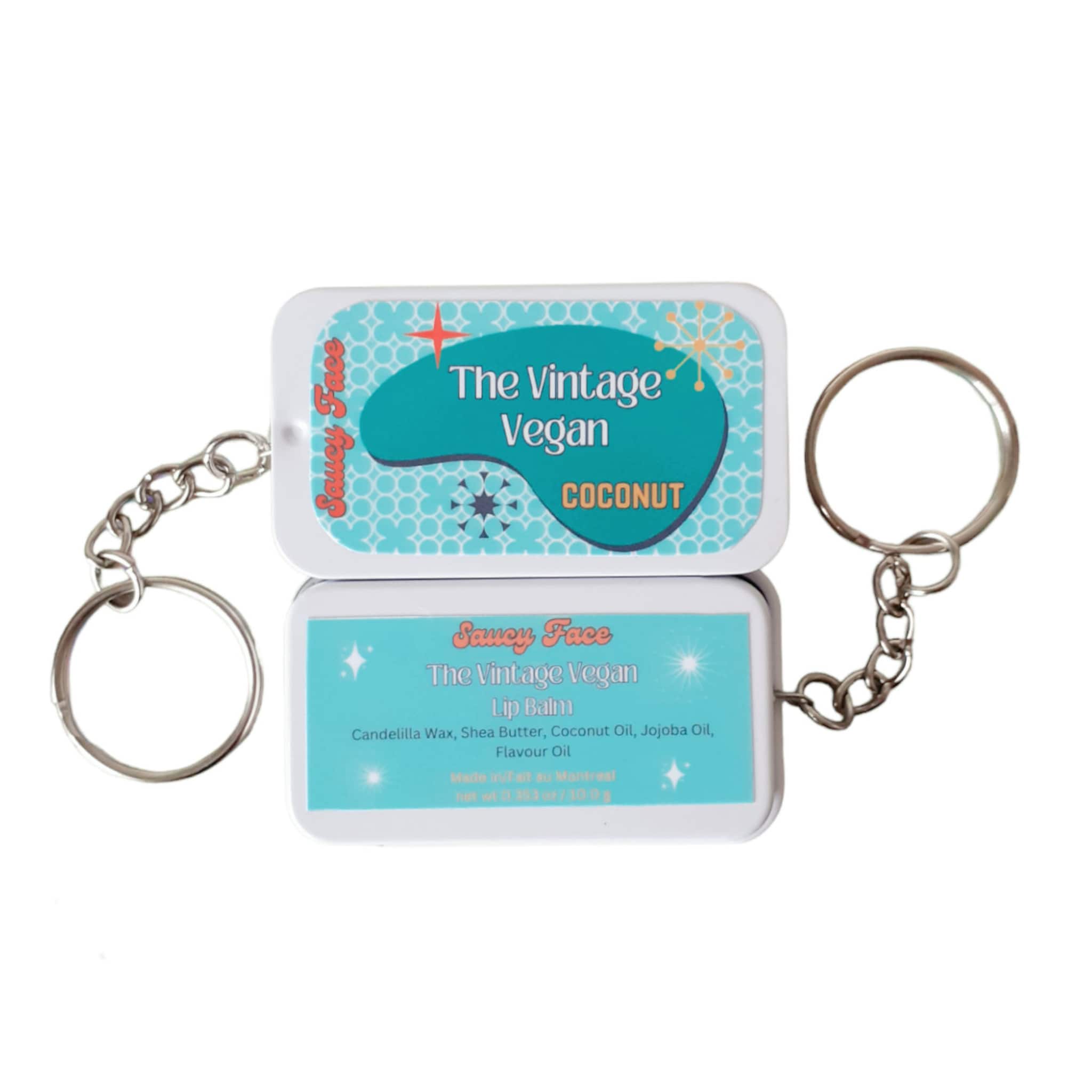 Lip balm tin with teal and white pattern, key ring, and Saucy Face brand text
