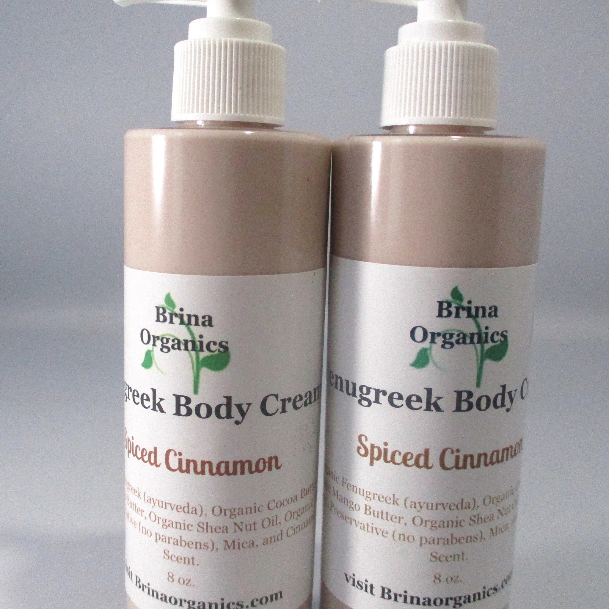 Body cream bottles, light brown with white pump, Brina Organics labels, Spiced Cinnamon scent
