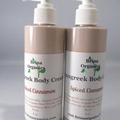 Body cream bottles, light brown with white pump, Brina Organics labels, Spiced Cinnamon scent