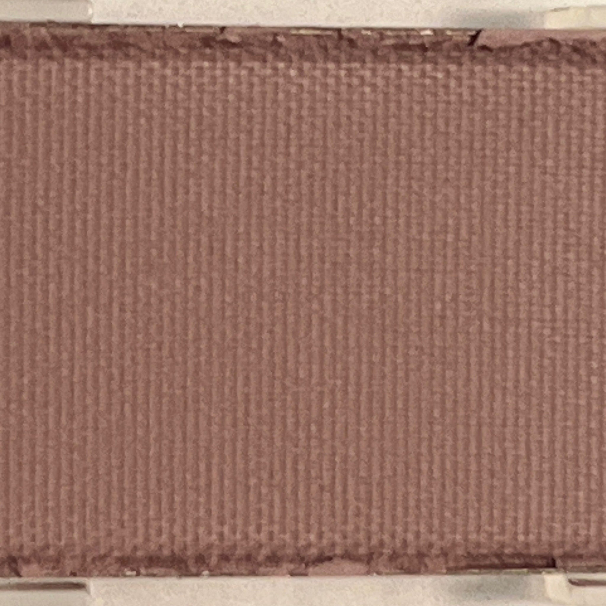 Single matte lavender eyeshadow pan with soft powder texture in minimalist black compact