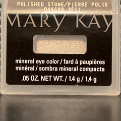 Side view of shimmering mineral eye shadow in polished stone hue with reflective flecks