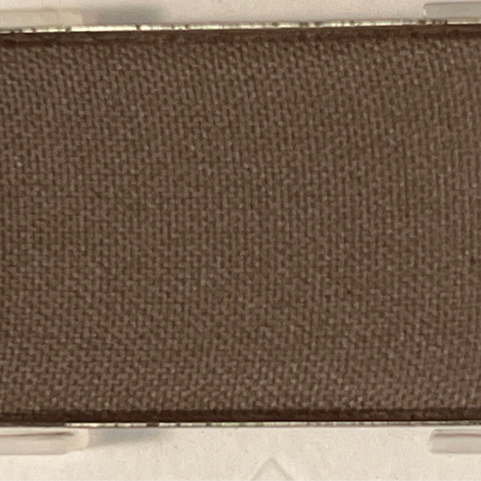 Close-up of Mineral Eye Shadow in Espresso, a rich brown powder with smooth matte finish in compact case