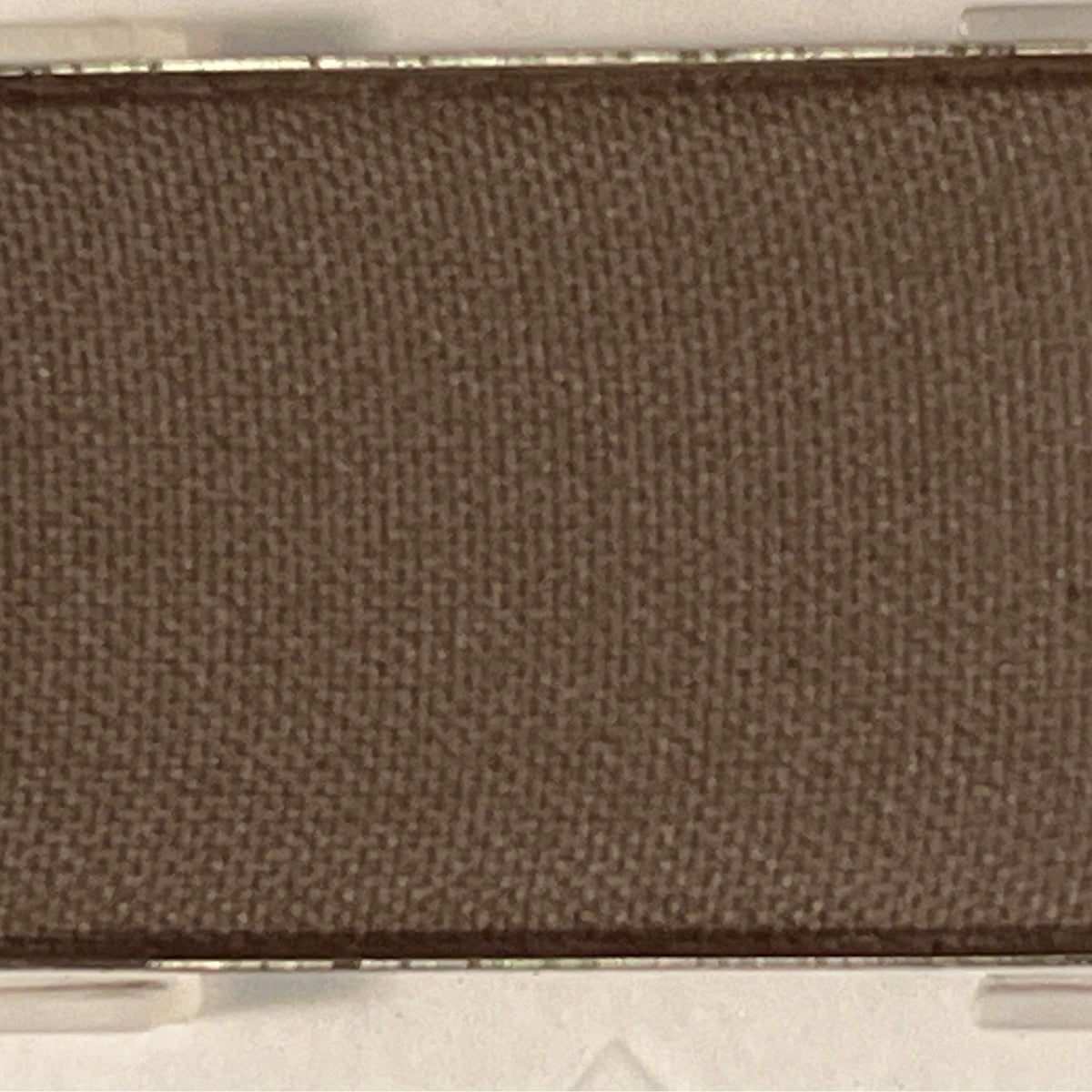 Close-up of Mineral Eye Shadow in Espresso, a rich brown powder with smooth matte finish in compact case