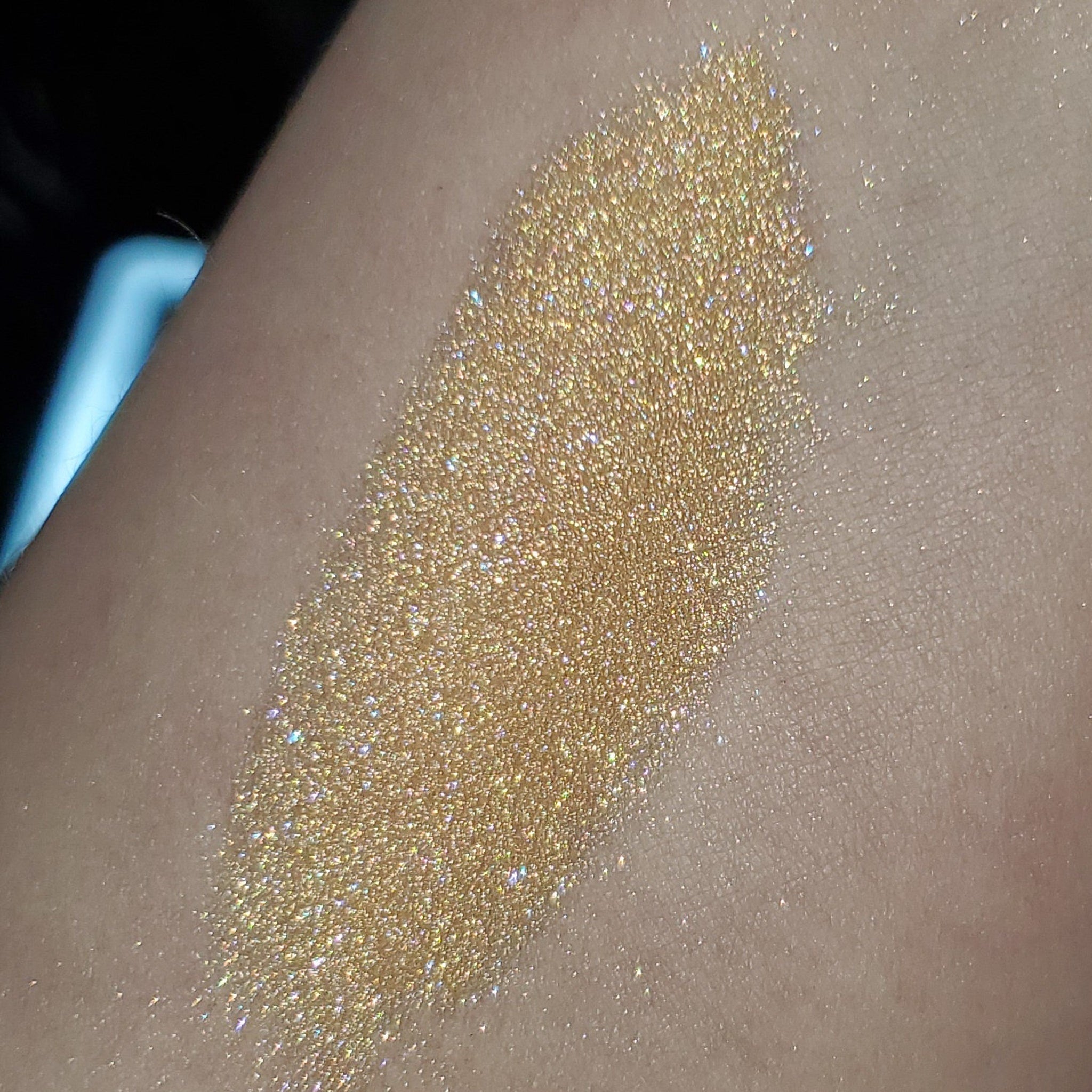 Front view of Chareth Cutestory Eye Shadow palette showing sleek black compact with gold logo