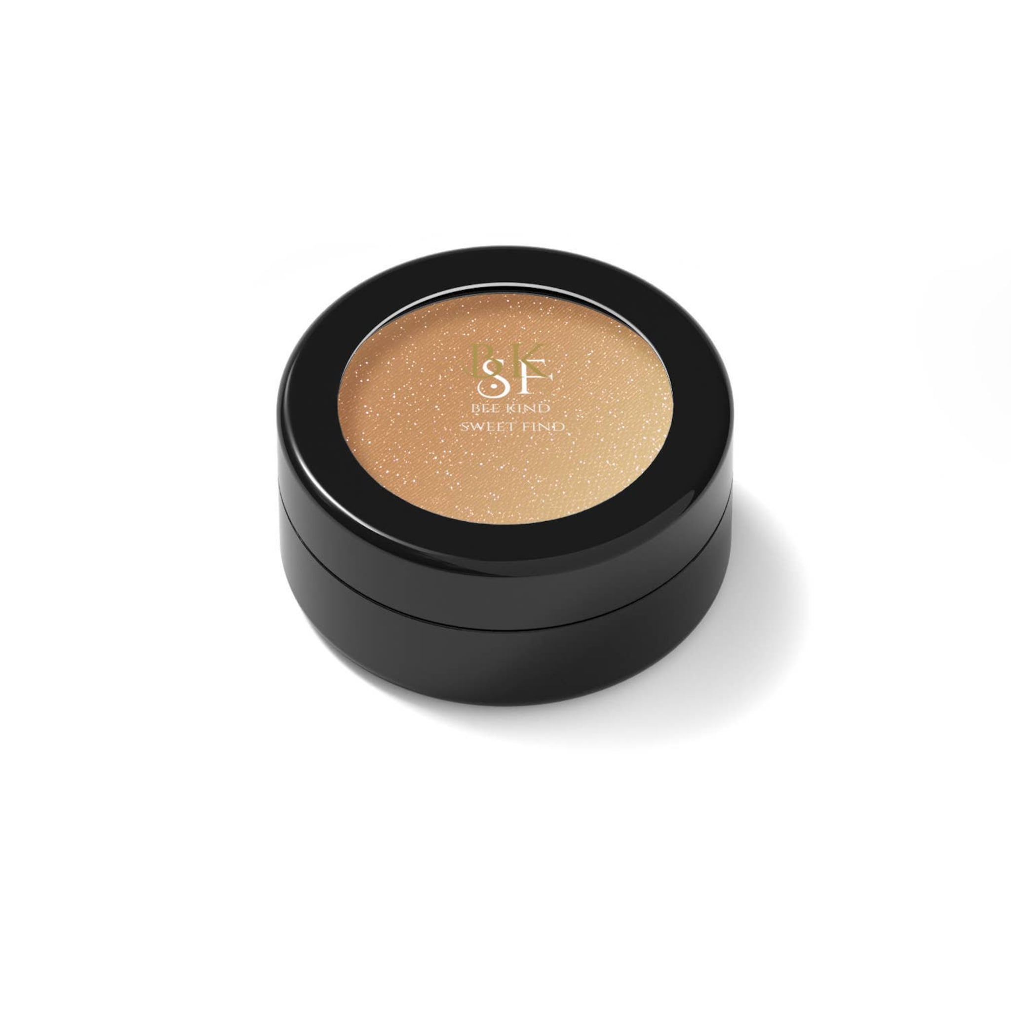 Eye shadow compact with gold shimmer and black case, Bee Kind Sweet Find text visible