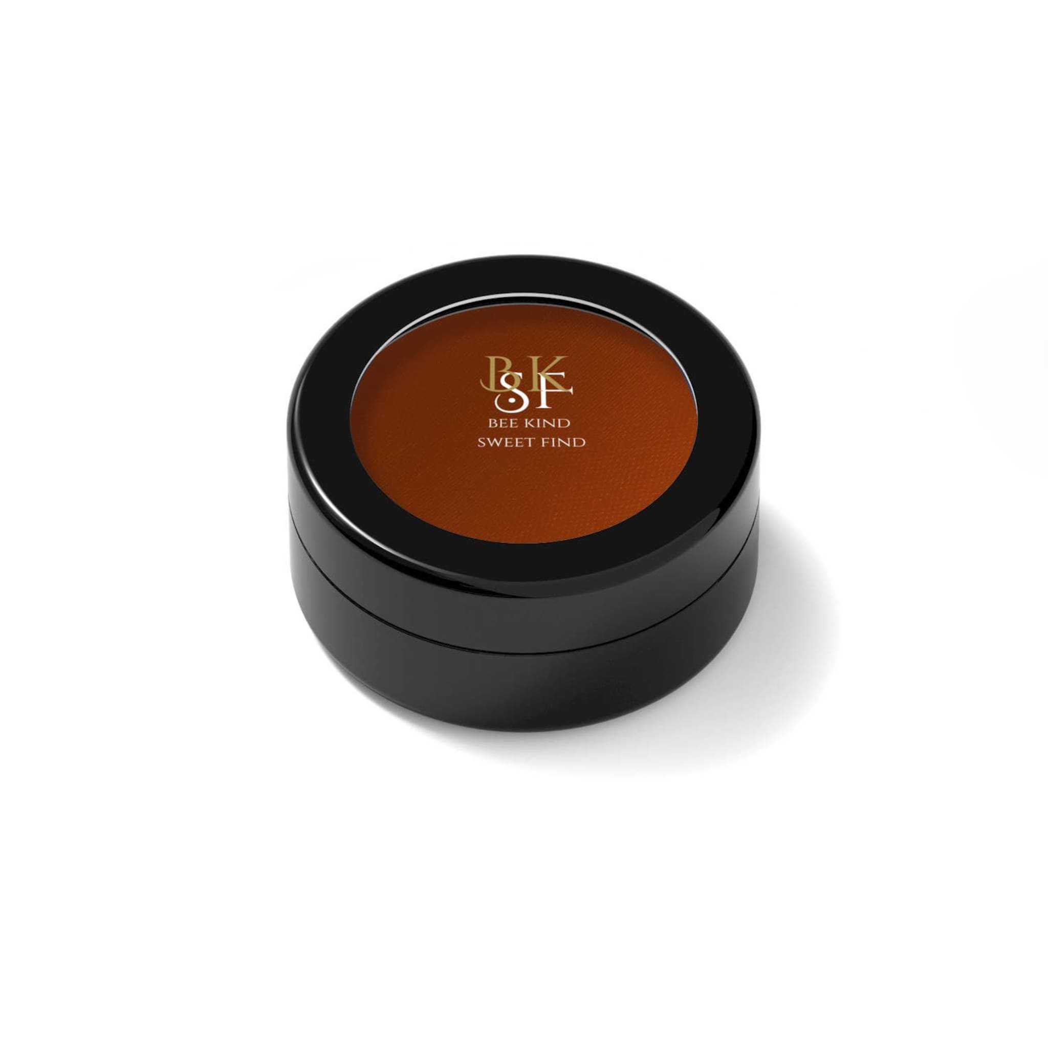 Round black compact with brown powder and BKSF brand text on top