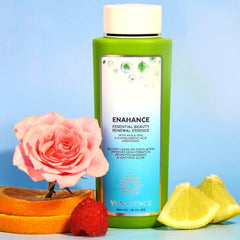 Facial cleanser bottle, green and white, with pink rose and fruit on blue background Yunasence