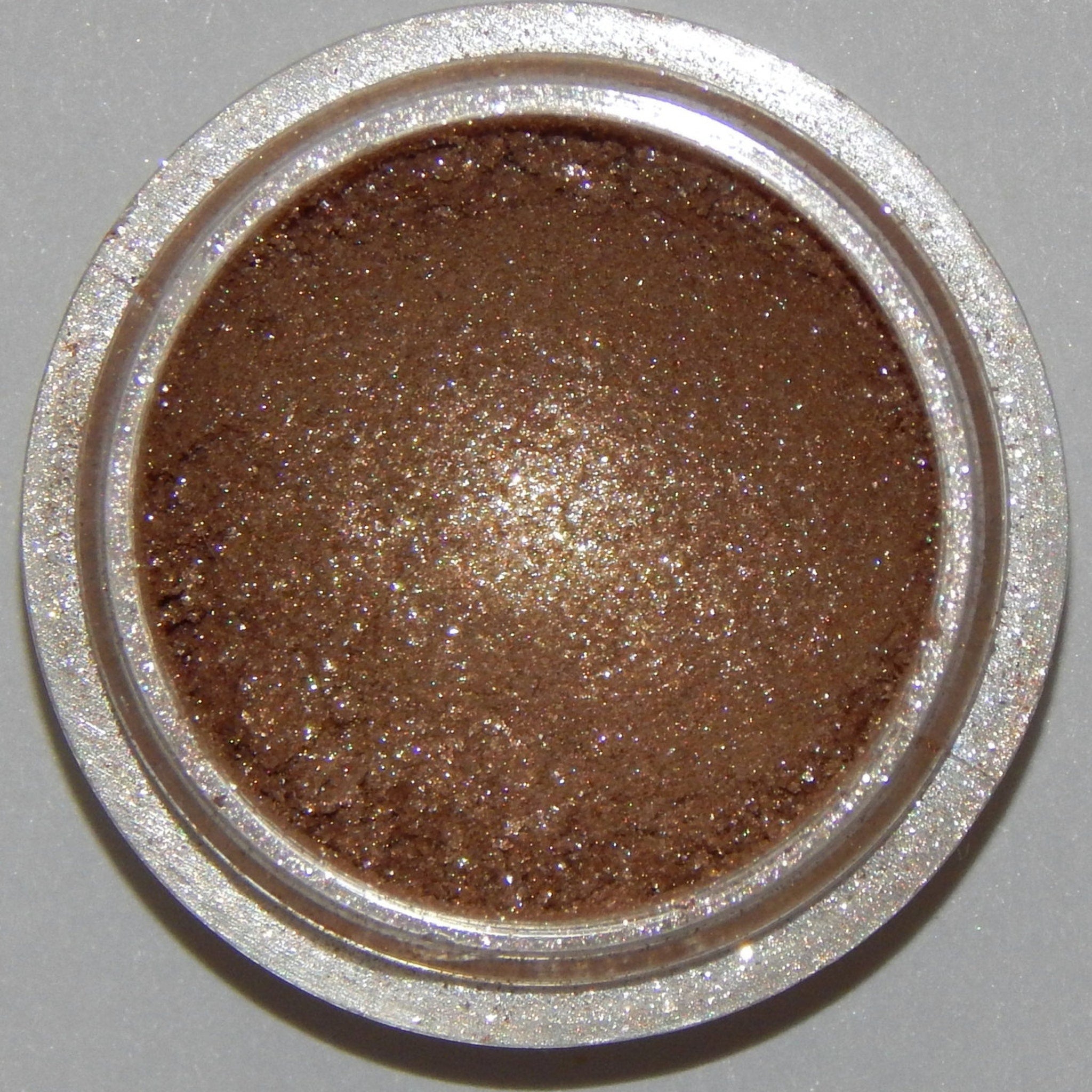 Frothy Mineral Eyeshadow pot in soft pastel shade with smooth, blendable texture and minimalist round packaging