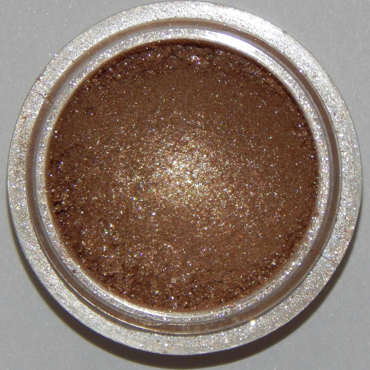 Frothy Mineral Eyeshadow pot in soft pastel shade with smooth, blendable texture and minimalist round packaging