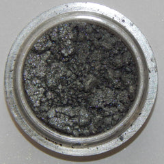 Close-up of Arc Angel Mineral Eye Shadow showing shimmering silver and blue swirls in compact pan